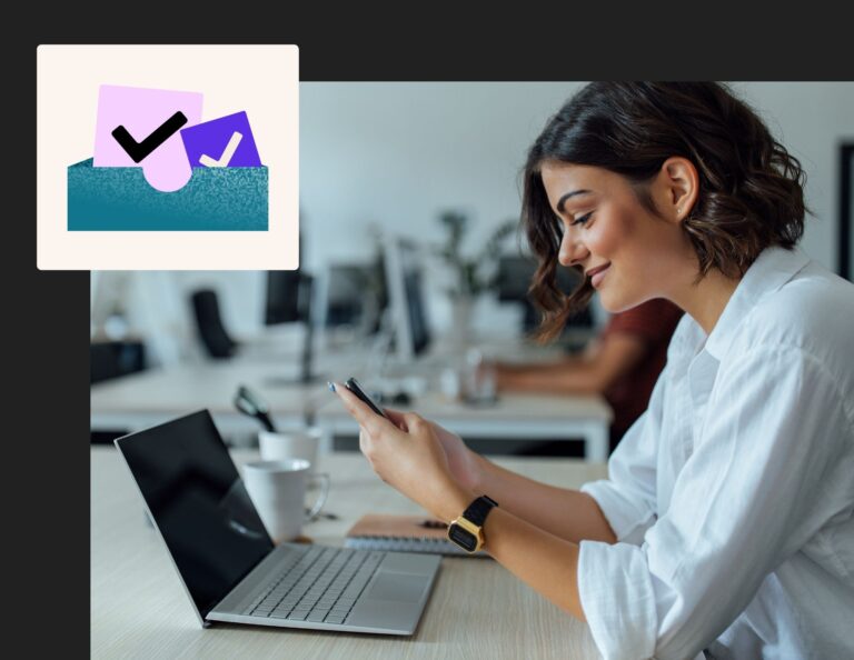 Woman uses phone and computer to check her emails after learning email deliverability best practices.