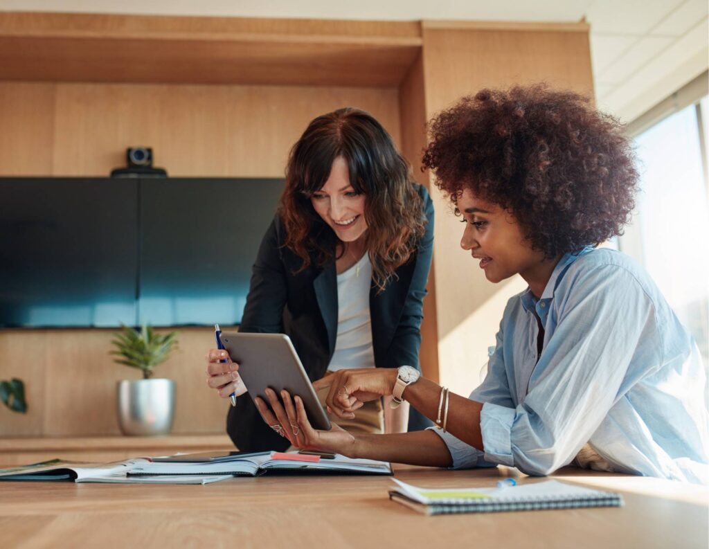 Employee and business owner working through a new hire checklist