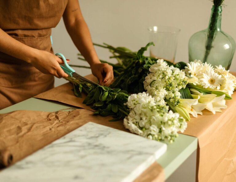 Wedding professional putting together a bouquet