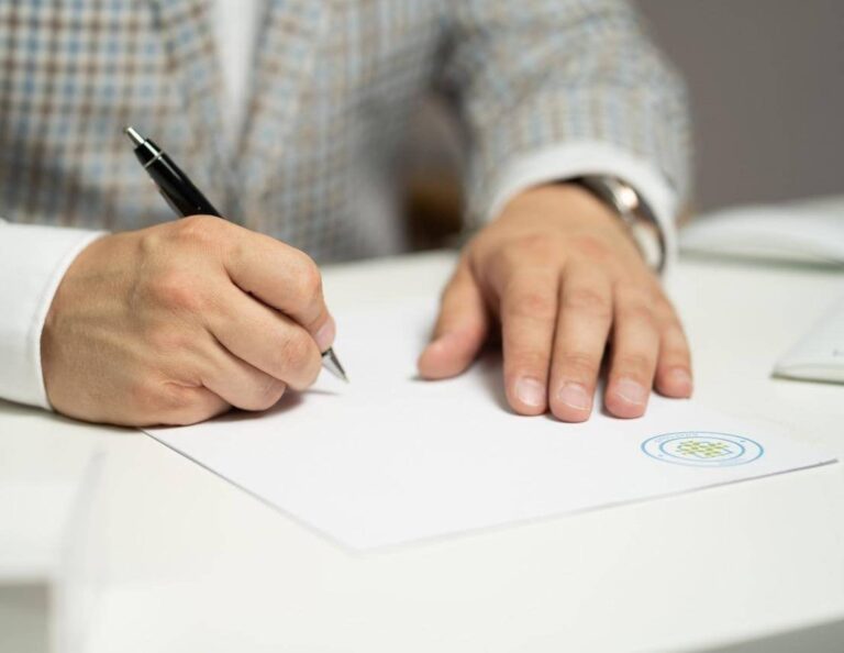 Person signing a business contract