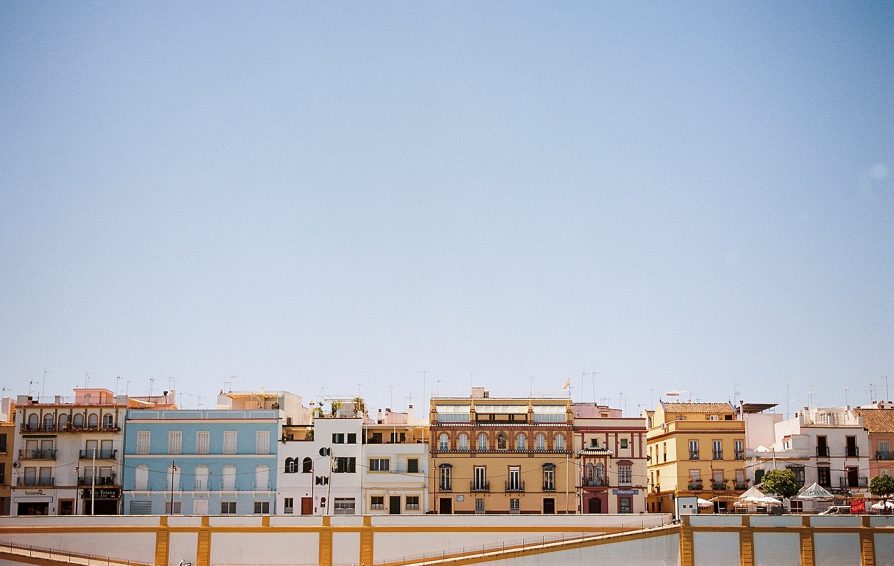 A photograph of Calle Betis in Seville on a sunny day, over the water