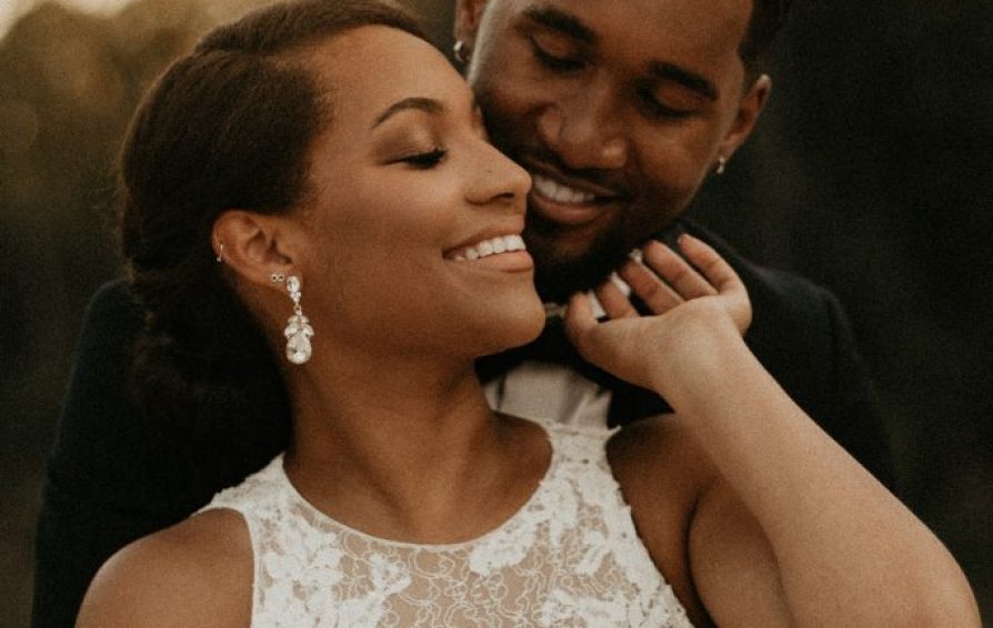 smiling bride and groom