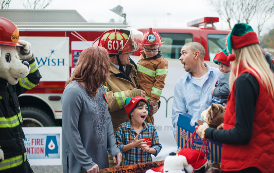business man and family giving time to the local fire department