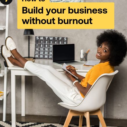 Woman puts her feet on her desk and writes in a notebook on the cover of the Build your business without burnout guide.