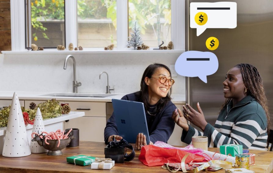 Two people thoughtfully talk about making sales during the holidays.