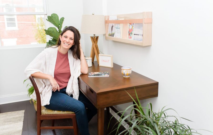 HoneyBook Pro Laura Neff sitting at a desk explaining how you can spend this year maximizing your profit in just four steps