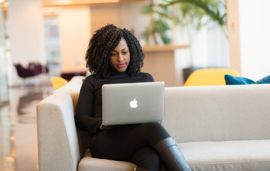 a woman on a laptop learning how to grow revenue with online courses