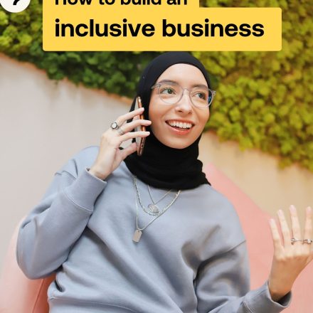 Woman talks on the phone on the cover of how to build an inclusive business guide.
