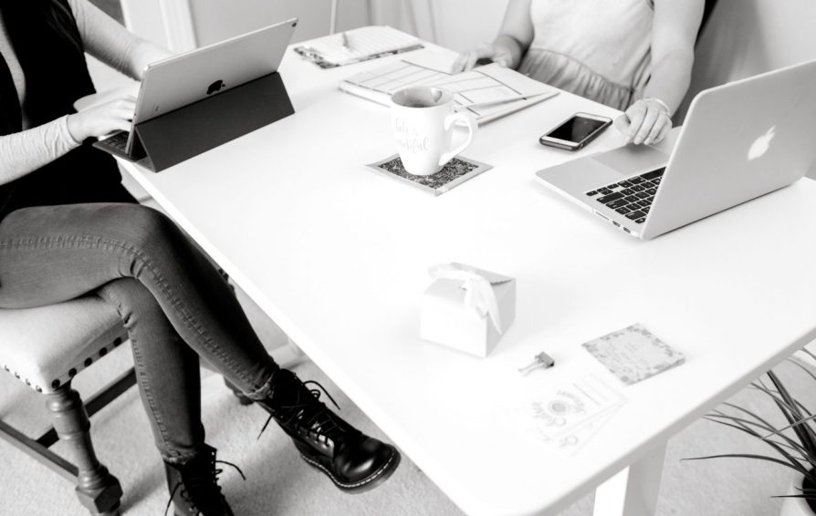 woman sitting at a table learning how to create engaging content
