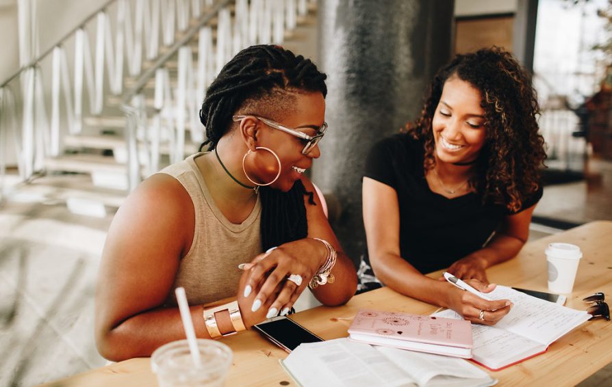two women working on their passion project