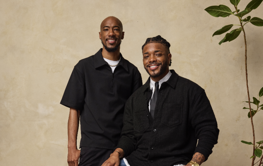 a photo of troy barnes and orlando whigham of mirror image photo booths smiling at the camera