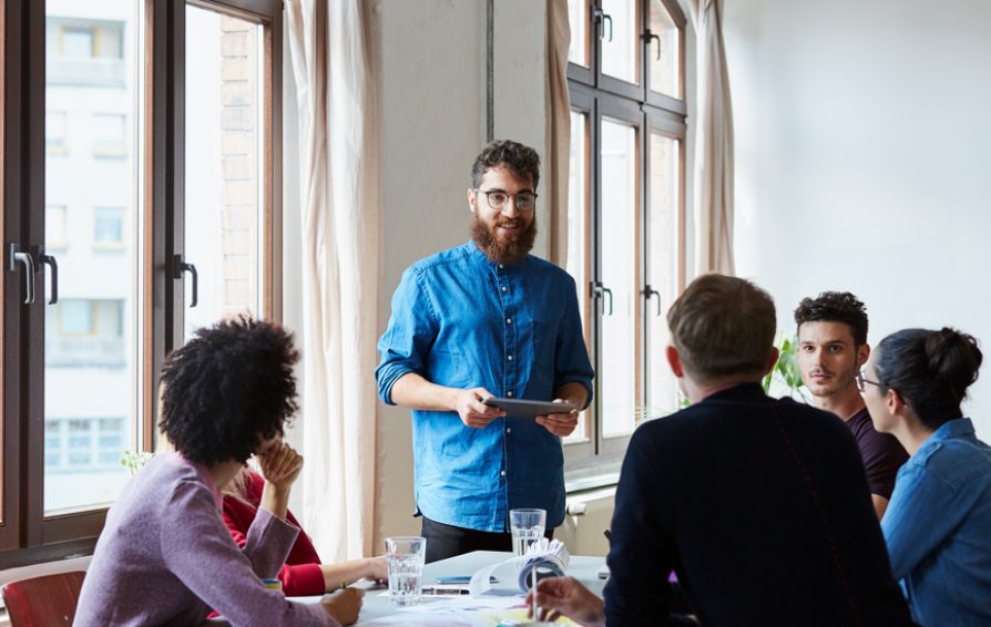 man talking to a group of people about how and when to discount and still profit