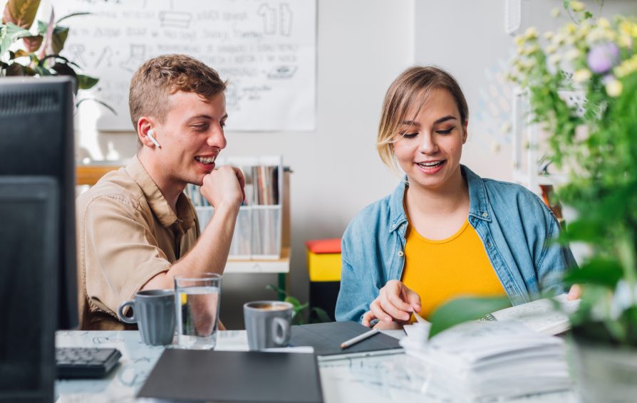 man and woman in an office learning how to convert more clients