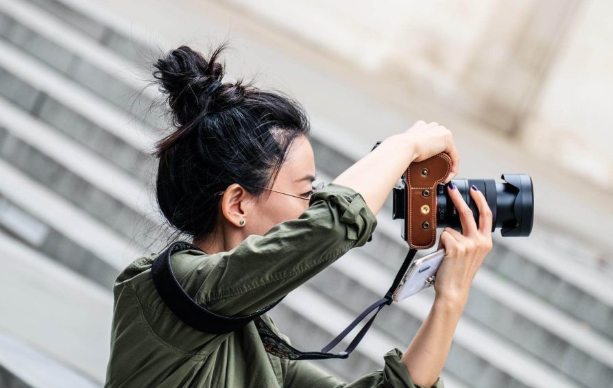 a woman holding a camera