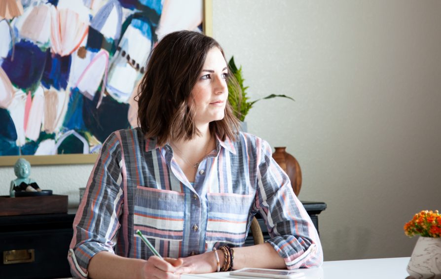 business woman managing time at her desk