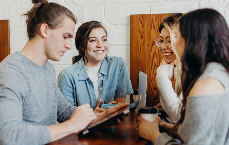 group of people connecting at a local coffee shop