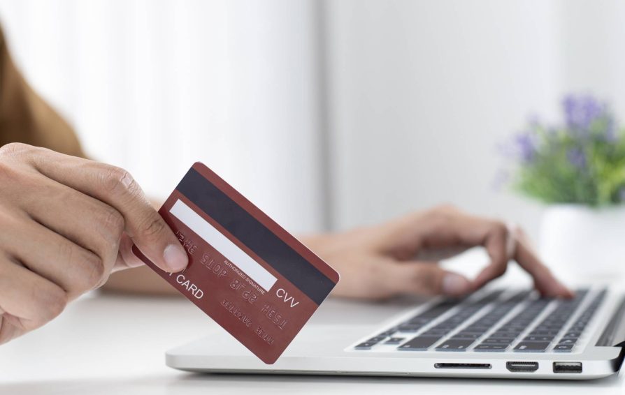 Person using a credit card processing platform on their laptop