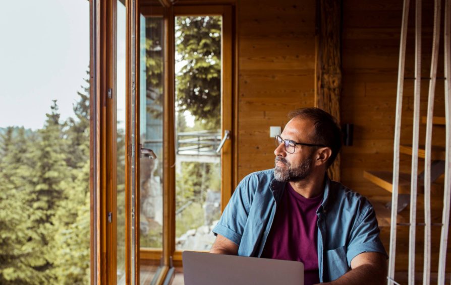 man on a laptop learning How to Create an Authentic Brand Identity