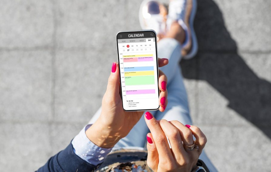 Person using a business scheduling app on their phone