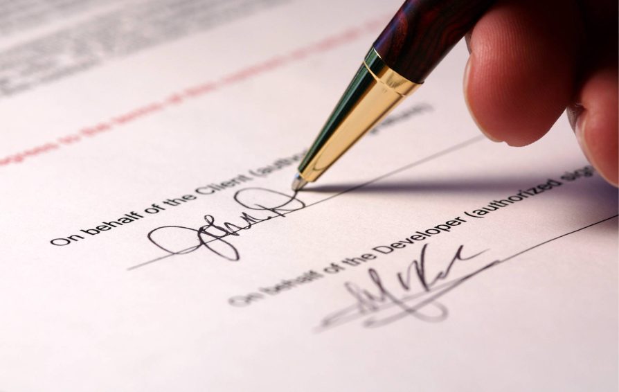 Person signing a contract