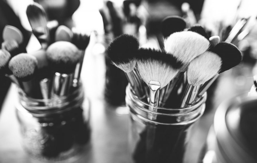 makeup brushes in glass jars