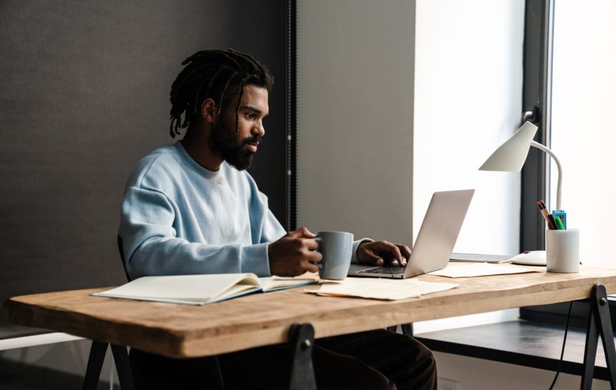 confident young african man freelancer working