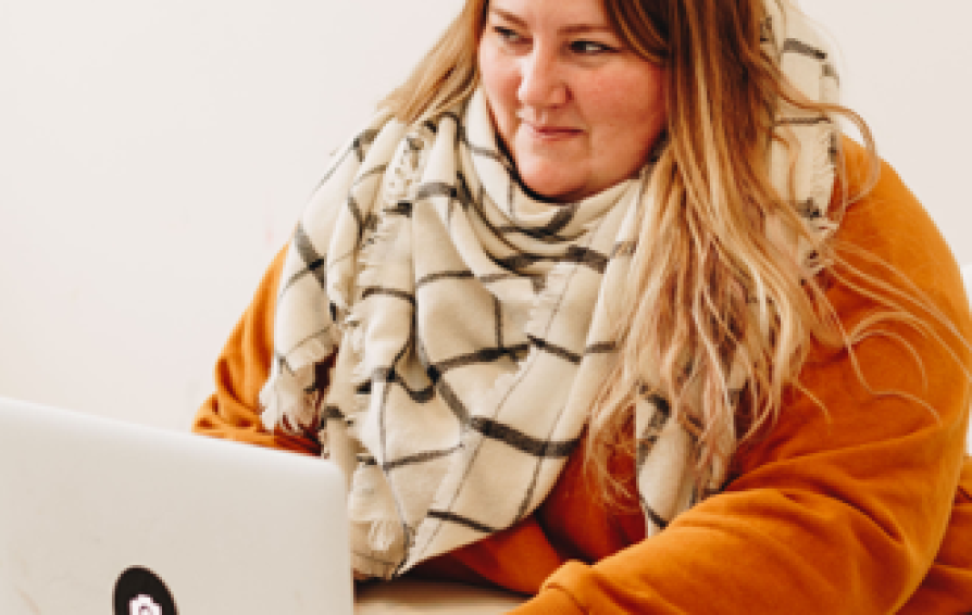 woman using a laptop to connect with others online