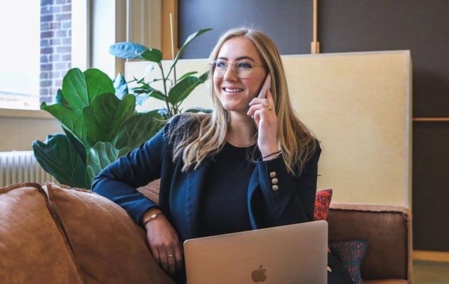 Woman conducting consultative selling on the phone