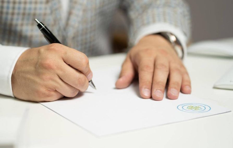Person signing a business contract