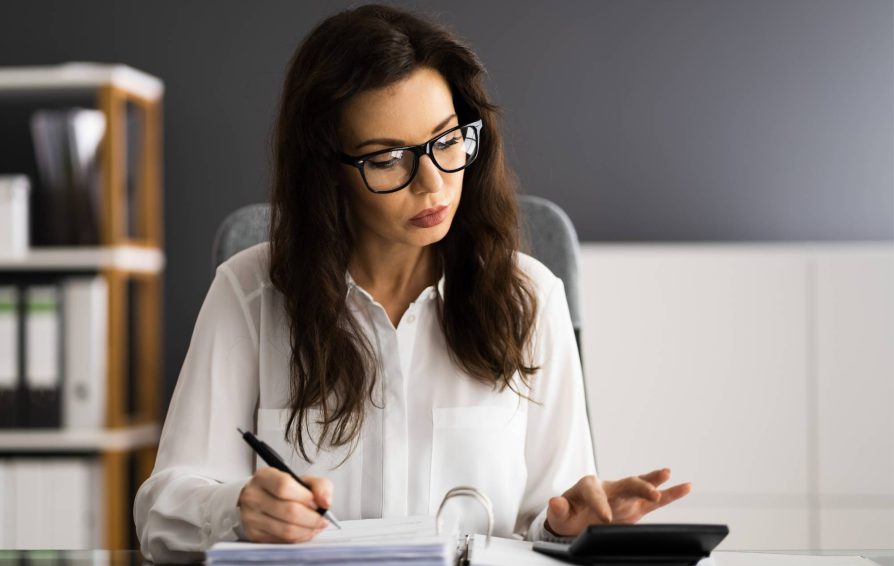 Woman working on creating an invoice