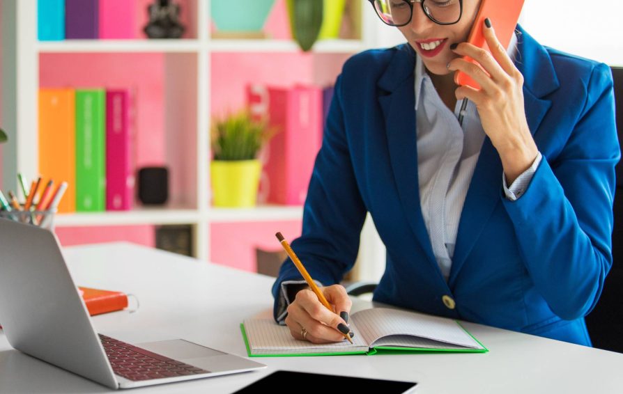 Woman evaluating customer fit on the phone