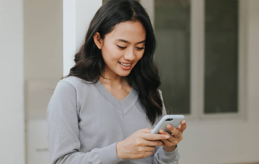 Woman reading a drip email campaign