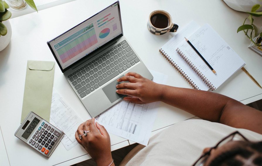 Woman evaluating her finances at a desk