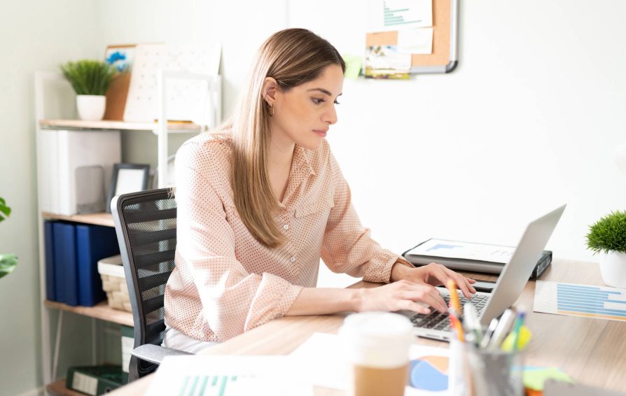 Woman using email automation tools on her laptop