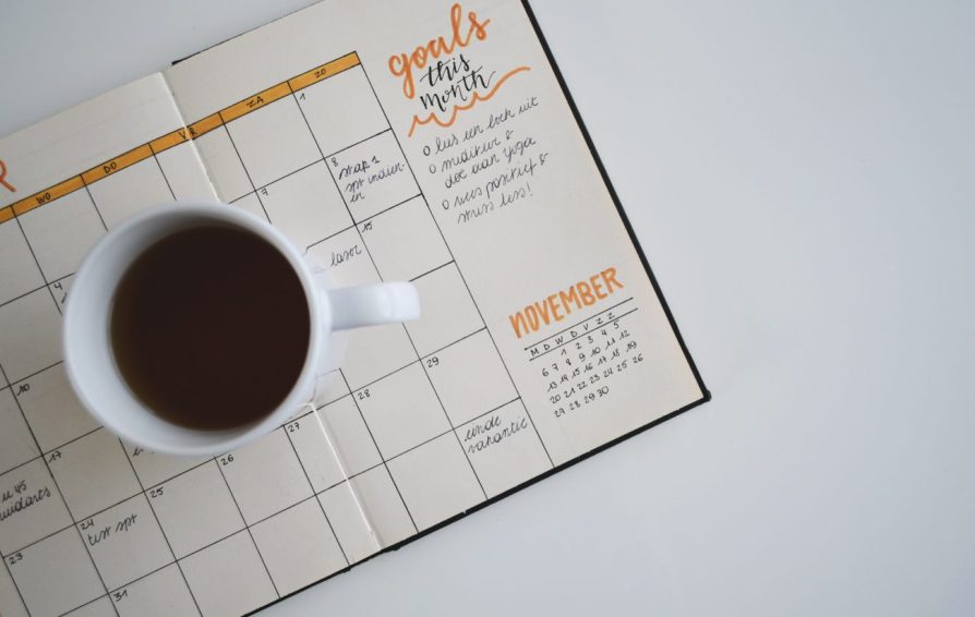 a calendar with a coffee cup on it
