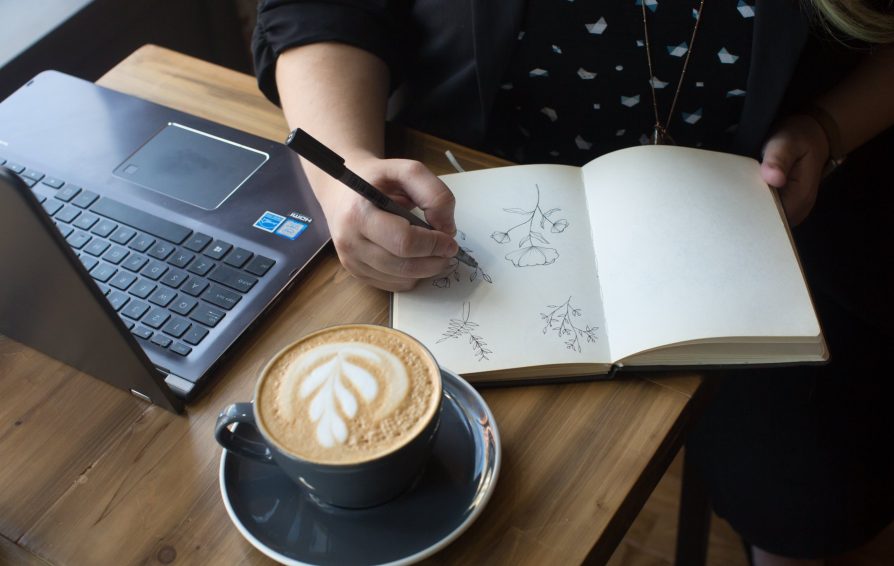 small business owner doodling brand personality ideas