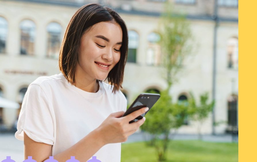 Woman processing payments on her phone