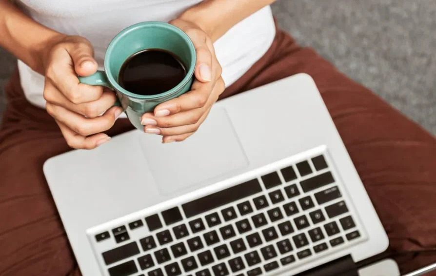 Person on laptop looking at HoneyBook plans