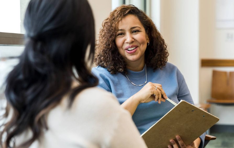 Two women involved in client communication