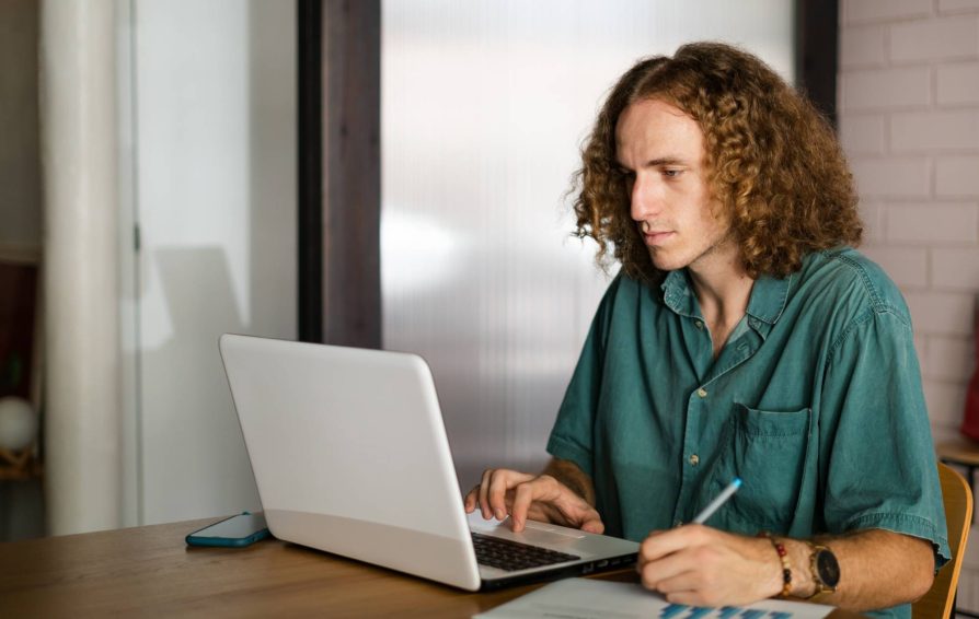 Man writing an invoice email