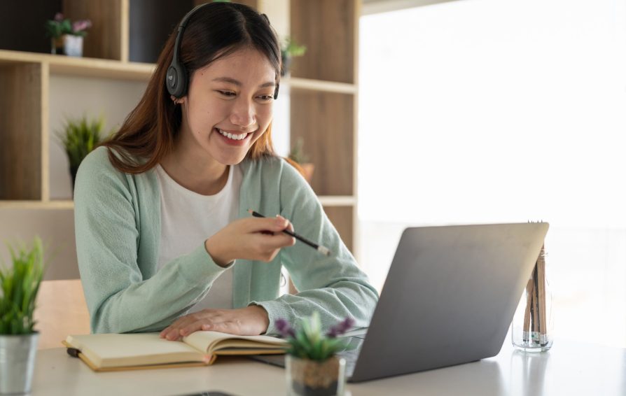 Freelancer invoicing on her laptop