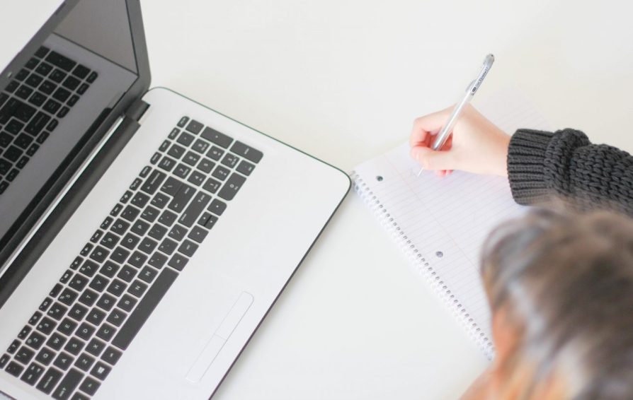 woman at a laptop learning how to diy seo as a small business