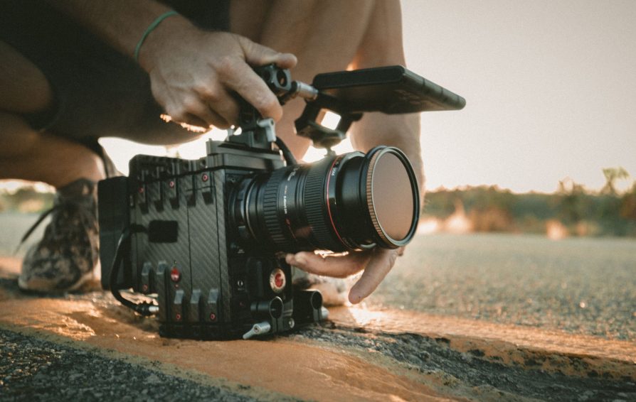 videographer using an expensive looking camera