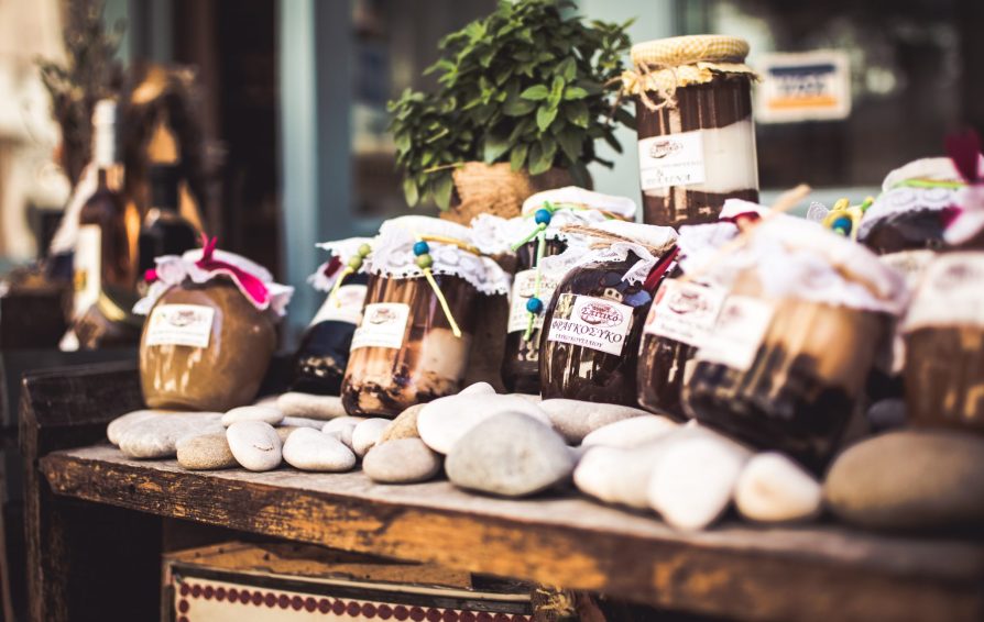 An assortment of hand-filled jars laid out on a table