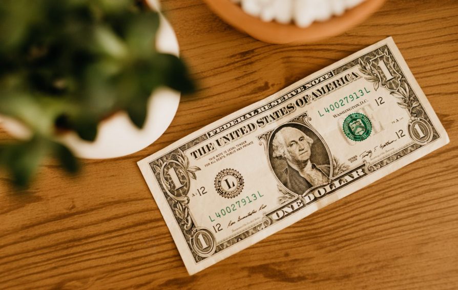Dollar bill on table