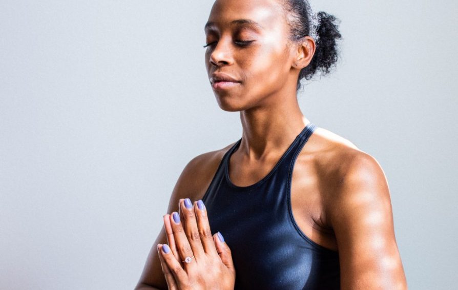 African American woman meditating.