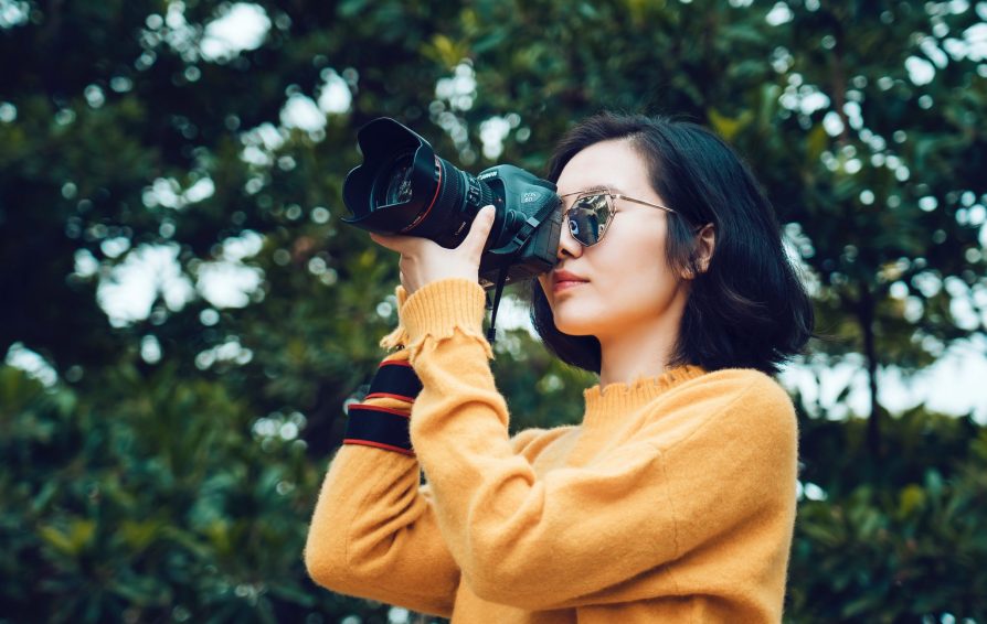 photographer taking a picture in nature