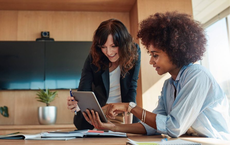 Employee and business owner working through a new hire checklist