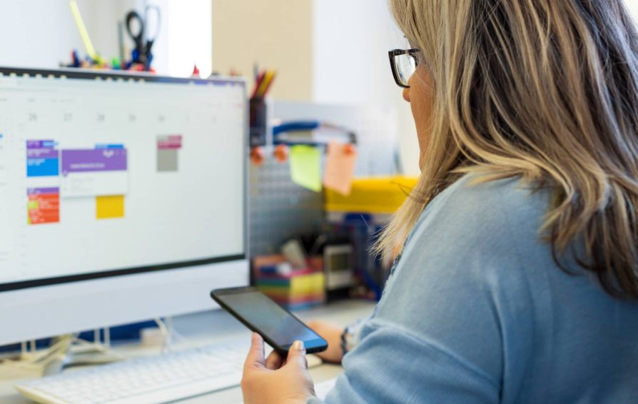 Woman setting up an online booking calendar
