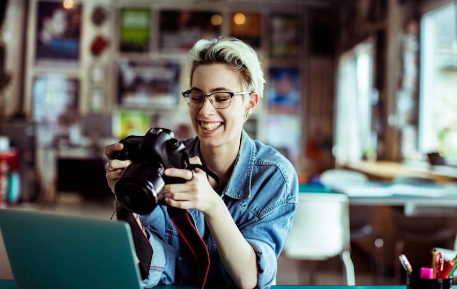 Photographer reviewing photos on a camera